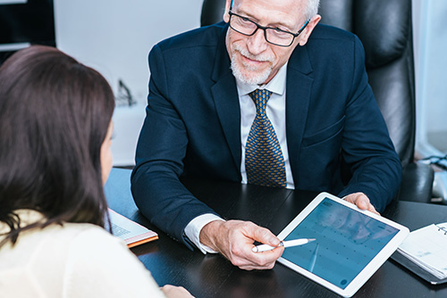 Woman meeting financial adviser in office